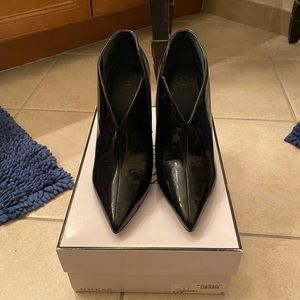 Guess black parent leather bootie.